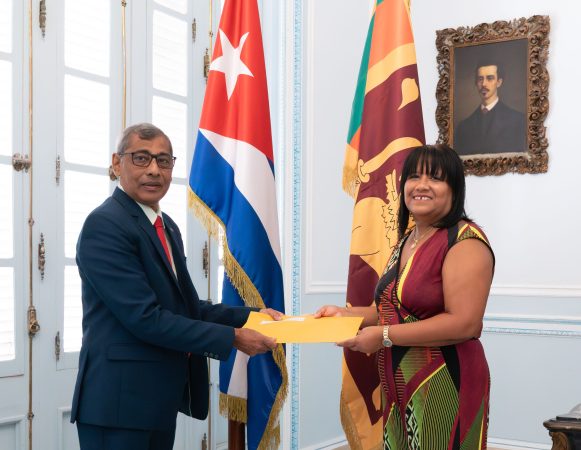 Ambassador – designate to Cuba presents the open copy of the Letter of Credence